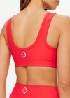 THE UPSIDE women's red Pacific Harley Scoop Neck Bra is made from recycled peached. The supportive sports bra features removable cups. Designed for yoga, pilates and barre.