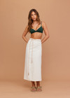 THE UPSIDE women's cream Beach Serenade Wrap Sarong is made from cotton. The beach sarong skirt features vegan leather braided belt. Designed for layering and travel.