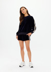 THE UPSIDE women's navy Monaco Lisel Crew Neck Sweater is a soft recycled velour fabric in a relaxed fit with a dropped shoulder. The perfect travel or everyday piece.