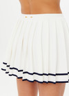 THE UPSIDE women's creme Cadiz Pleated Knit Skirt features an elasticated waistband with navy contrast knitted stripes. Perfect for tennis.
