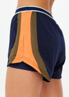 THE UPSIDE women's navy recycled fabric Starburst Lucky Run Short is designed for a true to size fit with invisible side zip pockets. Made for running.