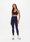 THE UPSIDE women's navy recycled fabric Oxford Harley Scoop Sports Bra is designed for a supportive fit and features removable cups. Made for high impact.
