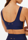 THE UPSIDE women's navy recycled fabric Oxford Harley Scoop Sports Bra is designed for a supportive fit and features removable cups. Made for high impact.