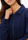 THE UPSIDE women's navy Vitesse Pari Zip Jacket comes in a slinky fabrication with mesh side tapes in contrast orange and side pockets. Designed for everyday leisure.