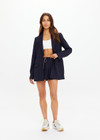 THE UPSIDE women's navy pinstripe merino Wool Boyfriend Blazer is a fully lined single breasted blazer with branded tortoiseshell buttons. Lean into a polished kind of comfort with our Wool Boyfriend Blazer.