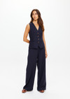 THE UPSIDE women's navy pinstripe merino Wool Mira Wide Leg Pant features a flat waistband with belt loops and side pockets.