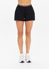 THE UPSIDE women's black Lucky Run Short is made from a recycled fabric featuring an elastic waistband and black inner short with invisible zip pockets. Ideal for high performance and running.
