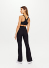 THE UPSIDE women's black Peached Florence Flare is a high-rise full length flare pant with V waistband and a printed arrow logo on back waistband.