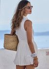 THE UPSIDE women's white Slam Pleated Tennis Dress features a quarter zip opening with mock neck, a pleated light-weight skirt with built-in inner short with pockets. Made for tennis.