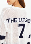 THE UPSIDE women's creme organic cotton Fenway Sebastian Knit Crew is designed for a relaxed fit and features ribbed neckline and cuffs with The Upside 7 logo on back.