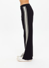 THE UPSIDE women's black Petra Flare Pant is made from soft suiting fabric and features elasticated waistband, side pockets and contrast cream stripes down side seams. Made for lifestyle.