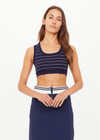 THE UPSIDE women’s Stripe Astra Solange Knit Crop Top offers a soft, comfortable fit with a navy-ribbed scoop neckline and elastic underbust. Perfect for travel or daily wear.