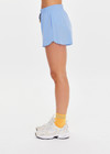 THE UPSIDE women’s blue recycled Era Short is designed to be mid rise, featuring a striped elastic drawcord and inner mesh brief in white. Made for running.