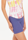 THE UPSIDE women's tie-dye organic cotton Asher Racerback Tank Top features hand tie-dyed tropical shades of pink, red, and yellow on a white base. Made for lifestyle.