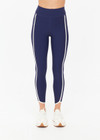 THE UPSIDE women's navy recycled peached Samara 25inch Legging is a soft & supportive fit and features side pockets and contrast cream stripes with curved hem detail. Made for pilates.