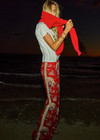 THE UPSIDE women's red Palma Sierra Wide Leg Pant features cream contrast panels, turquoise piping, soft elastic waistband, and side pockets. Perfect for travel or lifestyle.