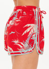 THE UPSIDE women's red Palma Klio Short features contrast turquoise binds on curved hem and waist drawcord with antique brass cord ends. Perfect for travel or everyday.