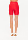 THE UPSIDE women's red eco tech Oxford 5-inch Spin Short is supportive and comfortable with mid-rise, cream side stripes, and elastic waist drawcord. Made for high impact.