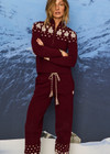 THE UPSIDE women’s maroon organic cotton Le Ski Jojo Knit Jogger features a soft knitted waistband with braided tassel drawcord, side pockets and snowflake design at ankles. Designed for Après-ski and winter wear.