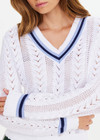 THE UPSIDE women’s white Citta Sonny V Neck Sweater is a fitted, chevron-knit design in organic cotton. The perfect wardrobe addition.