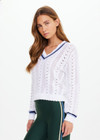 THE UPSIDE women’s white Citta Sonny V Neck Sweater is a fitted, chevron-knit design in organic cotton. The perfect wardrobe addition.