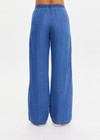 THE UPSIDE women’s blue Lykke Juliet Pant in soft chambray features a low-rise fit, split hem, and contrasting mesh knit side stripe. The perfect travel pant.