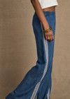 THE UPSIDE women’s blue Lykke Juliet Pant in soft chambray features a low-rise fit, split hem, and contrasting mesh knit side stripe. The perfect travel pant.