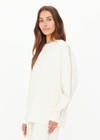 THE UPSIDE women’s creme cotton Hamsa Sunday Long Sleeve features a relaxed fit, dropped shoulders, and an embroidered evil eye on the sleeve. Perfect for layering.