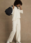 THE UPSIDE women’s creme cotton Hamsa Milou Wide Leg Pant features decorative contrast embroidery along side seams. The perfect travel pant.