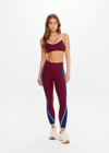 THE UPSIDE women’s maroon Adesa 25In High Midi Pant in recycled rib features a V-panel waistband and moisture-wicking properties. Made for high impact.
