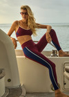 THE UPSIDE women’s maroon Adesa 25In High Midi Pant in recycled rib features a V-panel waistband and moisture-wicking properties. Made for high impact.