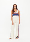 THE UPSIDE women’s creme recycled rib Adesa Vilde Knit Tank Top features a scoop neckline and small side slits at the hem. Made for everyday wear.