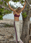 THE UPSIDE women’s creme Adesa Kansas Knit Pant is a wide-leg style featuring short hem splits and a soft elastic waistband. Made for lifestyle.
