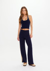 THE UPSIDE women's navy organic cotton Cosmo Freya Knit Pant is a true-to-size fit and features an elasticated waistband with beige knitted side stripes. Made for everyday wear.