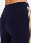 THE UPSIDE women's navy organic cotton Cosmo Freya Knit Pant is a true-to-size fit and features an elasticated waistband with beige knitted side stripes. Made for everyday wear.