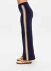 THE UPSIDE women's navy organic cotton Cosmo Freya Knit Pant is a true-to-size fit and features an elasticated waistband with beige knitted side stripes. Made for everyday wear.