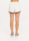 THE UPSIDE women's cream Klio Short is designed for a mid-rise, relaxed fit and features a soft elasticated waistband with drawcord and contrast binds in maroon along curved hem. Made for everyday.