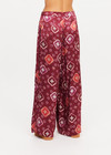 THE UPSIDE women's maroon Miri Kato silk wide-leg pant is designed for an oversized fit and features a gathered front waist with cream plaited drawcord. Made for lifestyle.