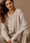 THE UPSIDE women's natural wool blend Xanthe Crew Neck Knit Sweater has a relaxed fit with cable knit and decorative blanket stitching. Made for lifestyle.