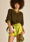 THE UPSIDE women's olive organic cotton Castilla Clementine Knit Crew is designed for a relaxed fit and features a high V neckline with lime-striped rib. Made for lifestyle.