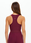THE UPSIDE women's maroon recycled peached Sophie Crop Top is designed for a soft and supportive fit and features a racerback longline bra with internal shelf bra. Made for yoga and pilates.