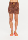 THE UPSIDE women's leopard organic cotton Malawi Karly Knit Mini Skirt offers a relaxed fit, featuring an elasticated waistband with orange drawcord and knitted stripes down sides. Made for lifestyle.