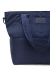 THE UPSIDE navy Barre Tote is fully insulated with multi internal pockets, a zip closure and an adjustable and removable shoulder strap. Made for everyday wear.