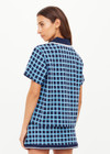 THE UPSIDE women's navy and blue plaid cotton Clubhouse Dom Polo Shirt is a relaxed fit and features a knitted collar with cream crochet detailing on edge. Made for tennis, golf & pickleball.