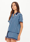 THE UPSIDE women's navy and blue plaid cotton Clubhouse Dom Polo Shirt is a relaxed fit and features a knitted collar with cream crochet detailing on edge. Made for tennis, golf & pickleball.