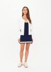 THE UPSIDE women's cream Jolie Isabeli Knit Cardigan is a regular fit with a blouson sleeve crafted from a pointelle knit and features navy embroidered bows. Made for tennis, golf & pickleball.