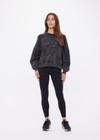 THE UPSIDE women's washed black Cosmic Paloma Crew is an oversized fit with a drop shoulder crafted from heavy organic cotton brushed fleece. Made for everyday.