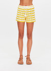 THE UPSIDE women's yellow organic cotton Goldie Malik Crochet Short is designed for a regular fit and features a hand crocheted flower design & an elasticated waist with tassel drawcord.