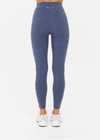 THE UPSIDE women's blue Bowery 25Inch Legging features ultraflex recycled fabrication with a mid-rise and cream embroidered stripes down side seams. Made for yoga and pilates.