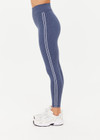 THE UPSIDE women's blue Bowery 25Inch Legging features ultraflex recycled fabrication with a mid-rise and cream embroidered stripes down side seams. Made for yoga and pilates.